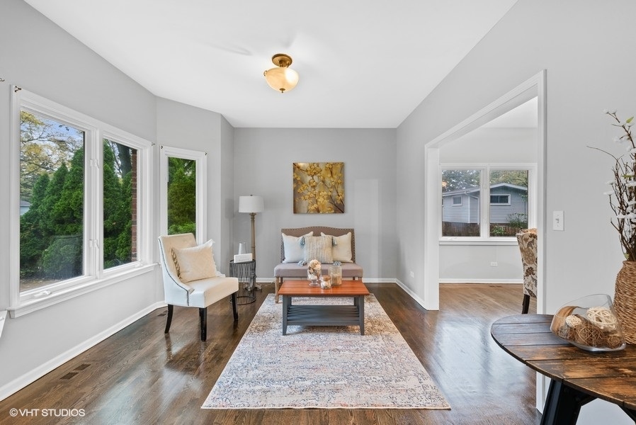 411 South Wilke Road Arlington Heights, IL 60005 - Photo 3 of 29 a living room with furniture and wooden floor