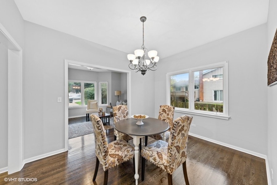 411 South Wilke Road Arlington Heights, IL 60005 - Photo 7 of 29 a view of a dining room with furniture and wooden floor