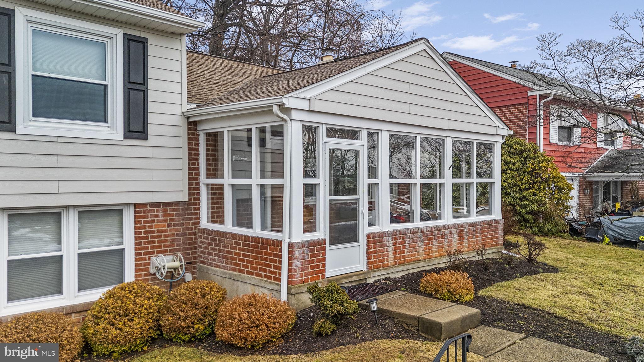 711 Elgin Road Newtown Square, PA 19073 - Photo 2 of 36 Front porch with removable windows