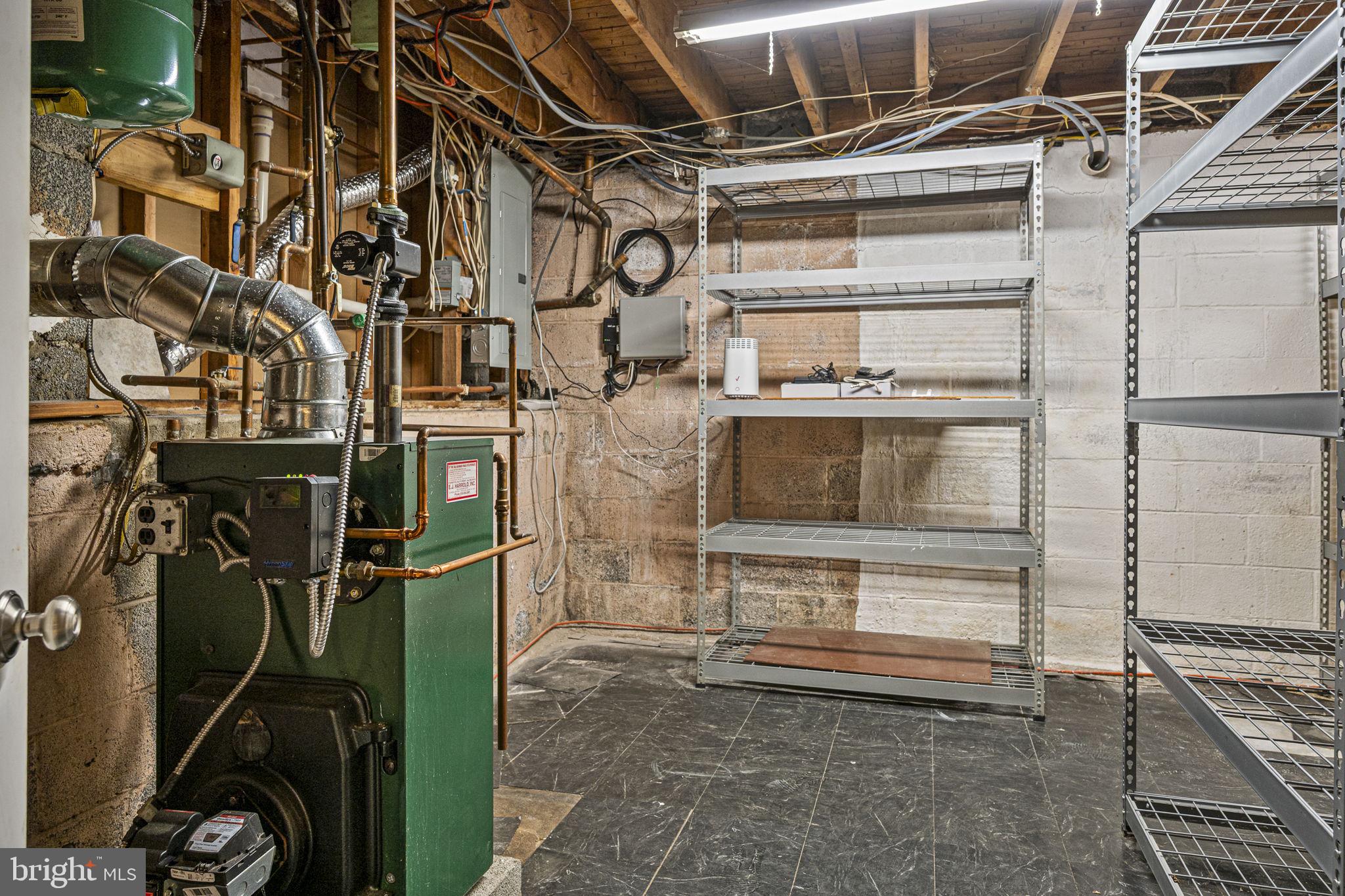 711 Elgin Road Newtown Square, PA 19073 - Photo 25 of 36 Utility room with storage and shelving