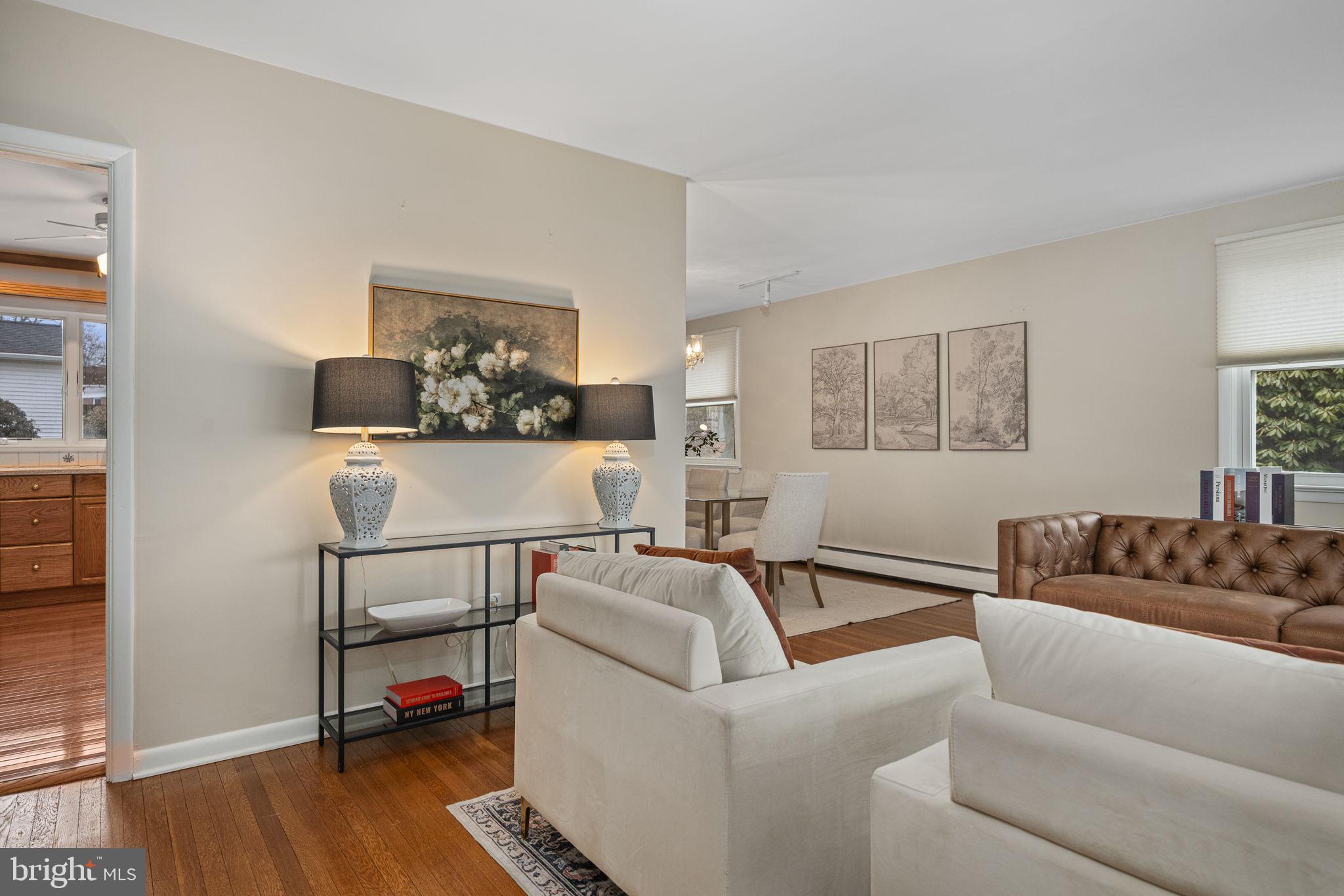 711 Elgin Road Newtown Square, PA 19073 - Photo 6 of 36 Living room flows seamlessly into dining room