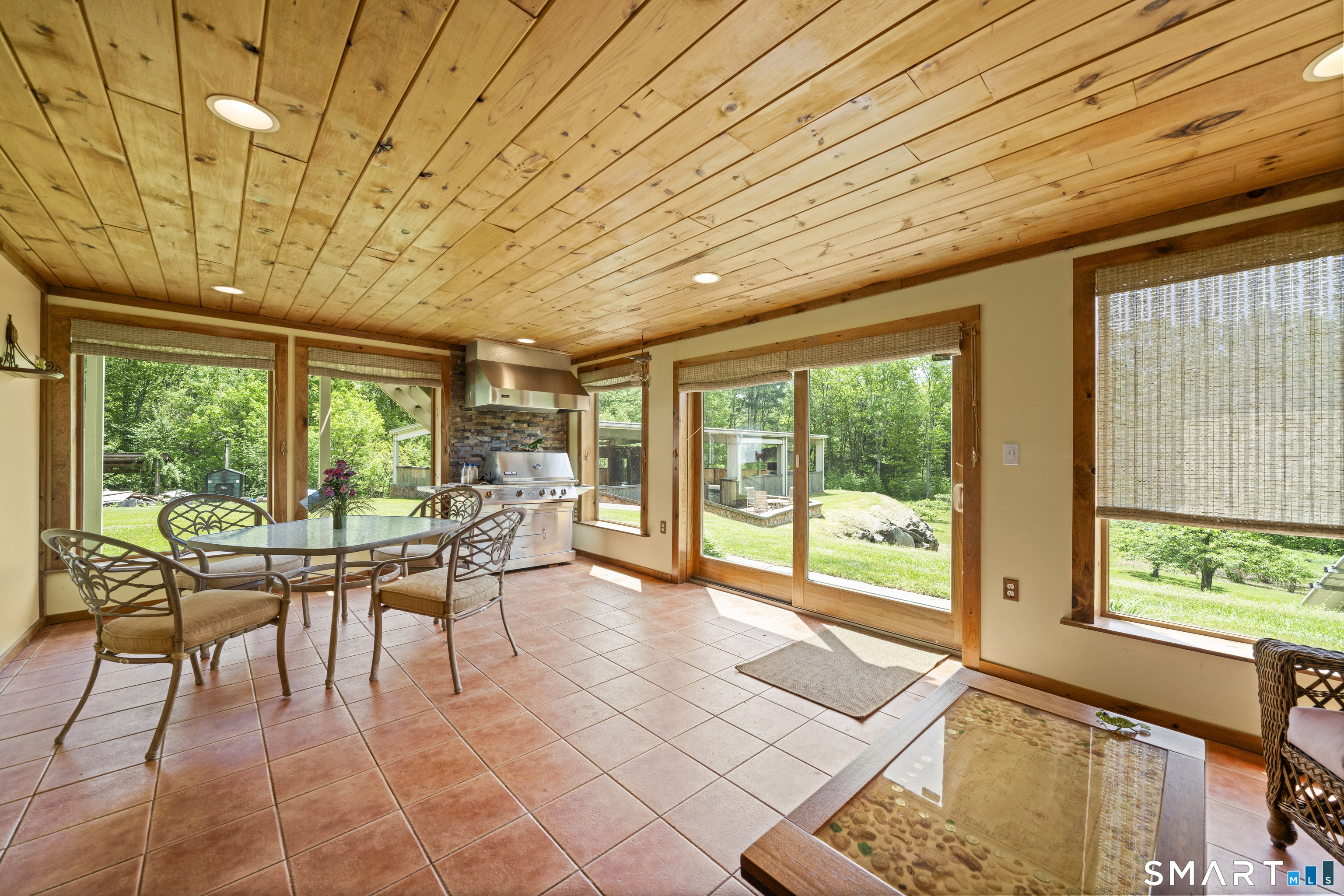 80 Holmes Road Goshen, CT 06756 - Photo 36 of 40 a dining room with furniture and a garden