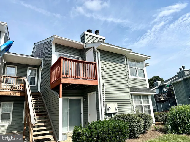 a front view of a house with garage