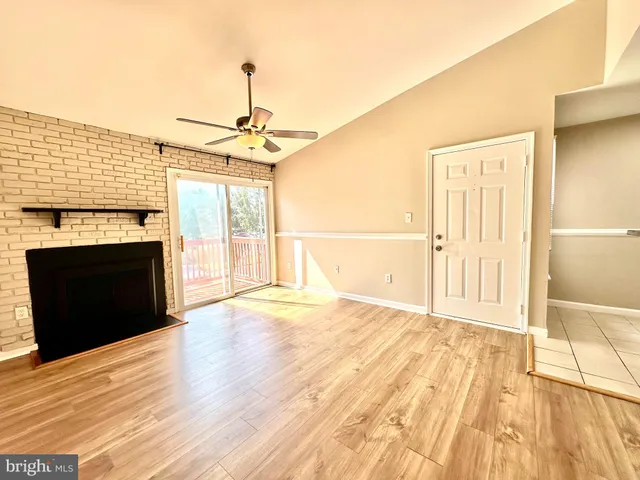 a kitchen with granite countertop a sink stove and cabinets