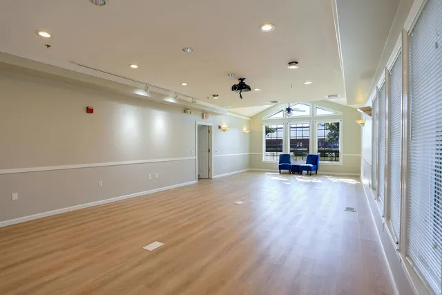 a view of kitchen with cabinets and wooden floor