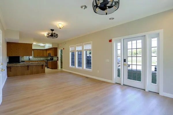 a kitchen with granite countertop a stove a sink and a microwave