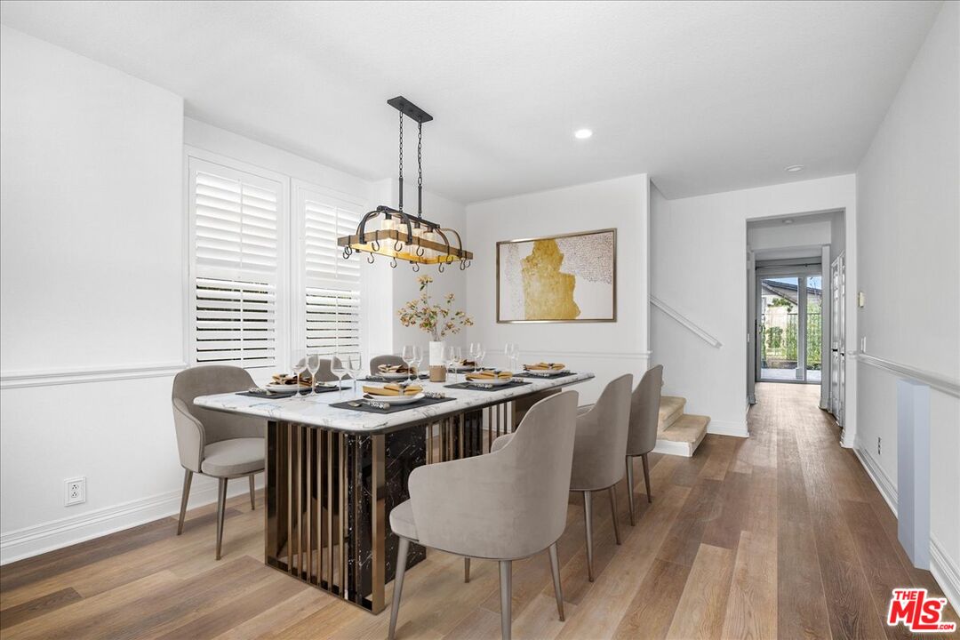 5 Sachem Way Ladera Ranch, CA 92694 - Photo 14 of 37 a dining room with furniture a chandelier and wooden floor