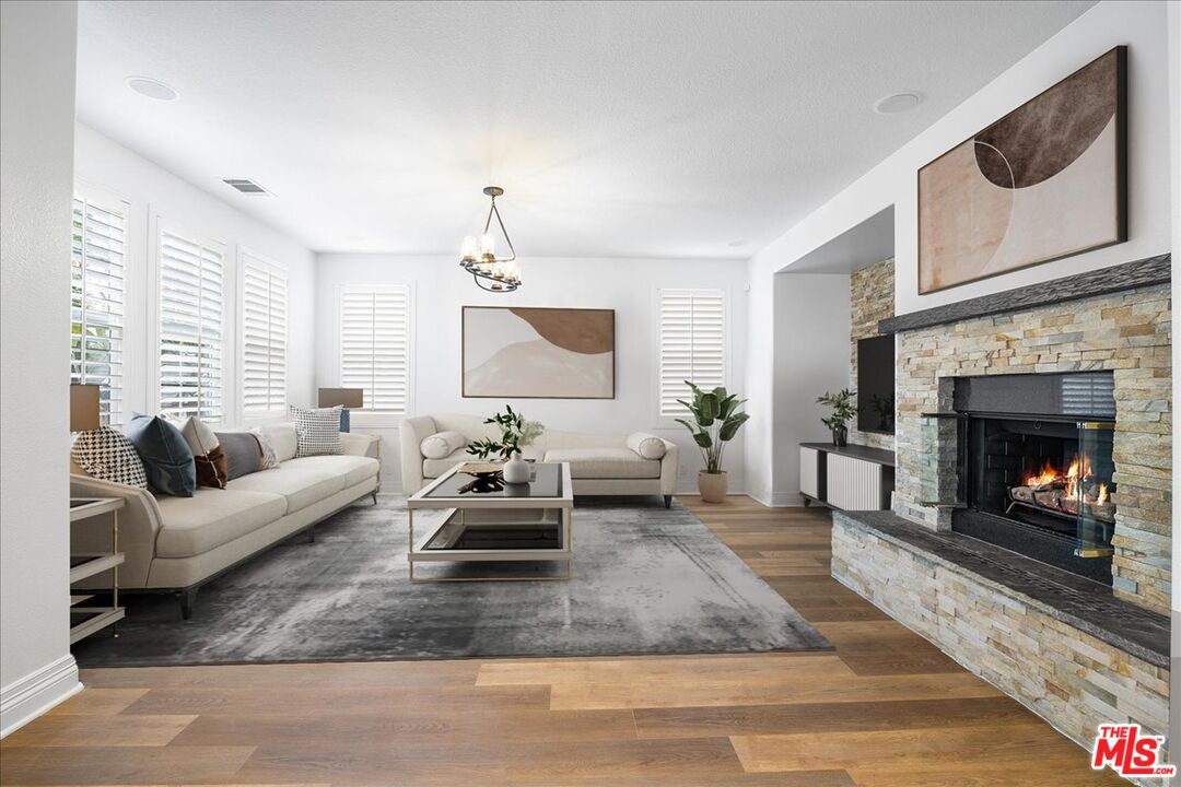 5 Sachem Way Ladera Ranch, CA 92694 - Photo 17 of 37 a living room with furniture and a fireplace