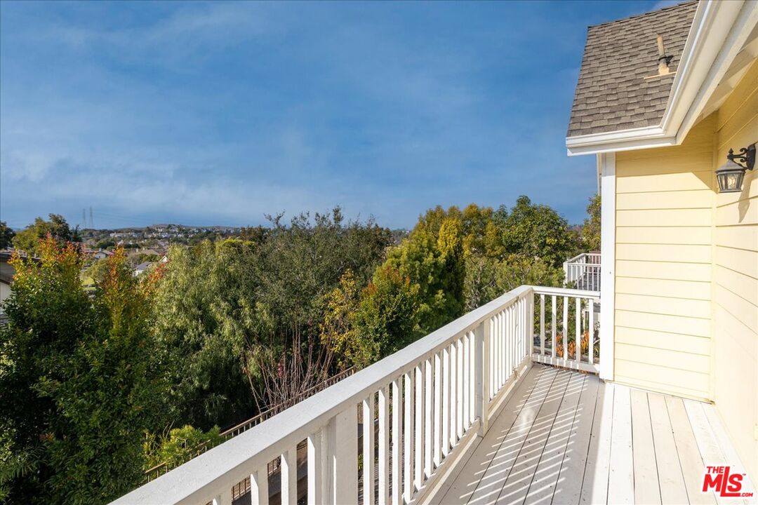 5 Sachem Way Ladera Ranch, CA 92694 - Photo 32 of 37 a view of a balcony with wooden fence and floor