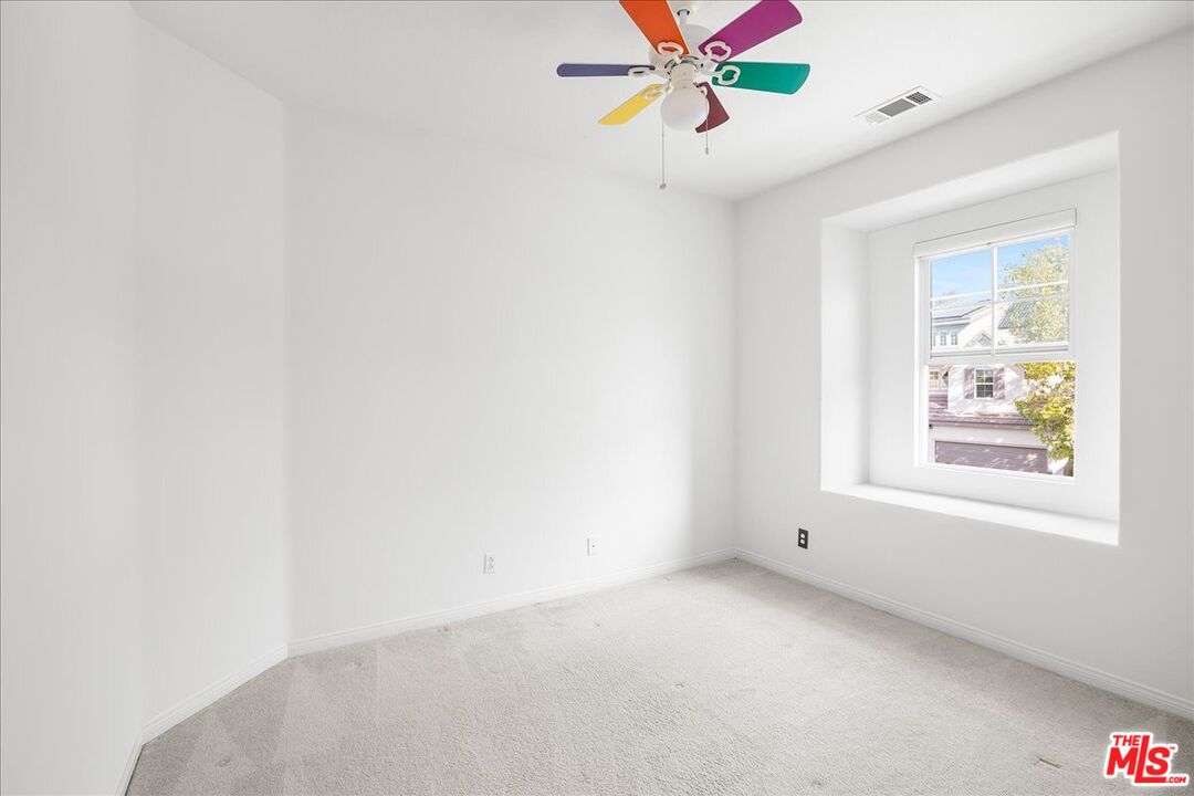 5 Sachem Way Ladera Ranch, CA 92694 - Photo 36 of 37 an empty room with windows and fan