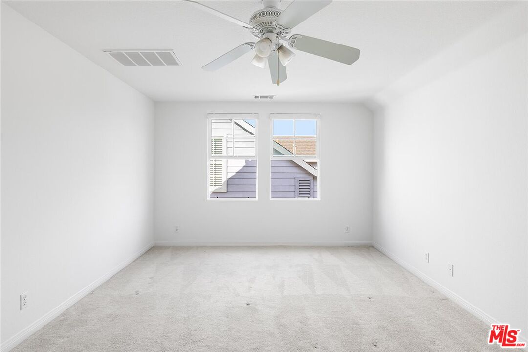5 Sachem Way Ladera Ranch, CA 92694 - Photo 10 of 37 an empty room with a window and a fan