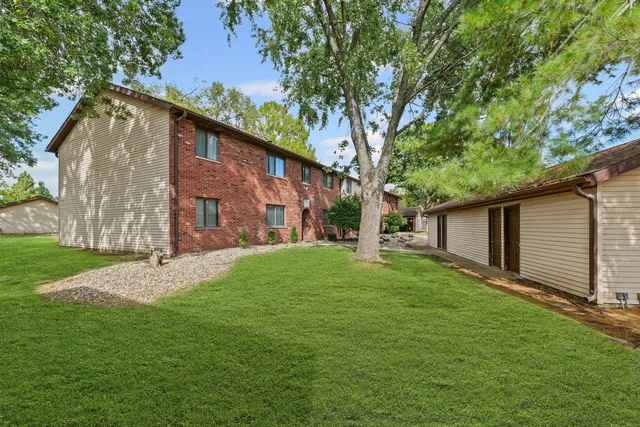 a backyard of a house with seating space