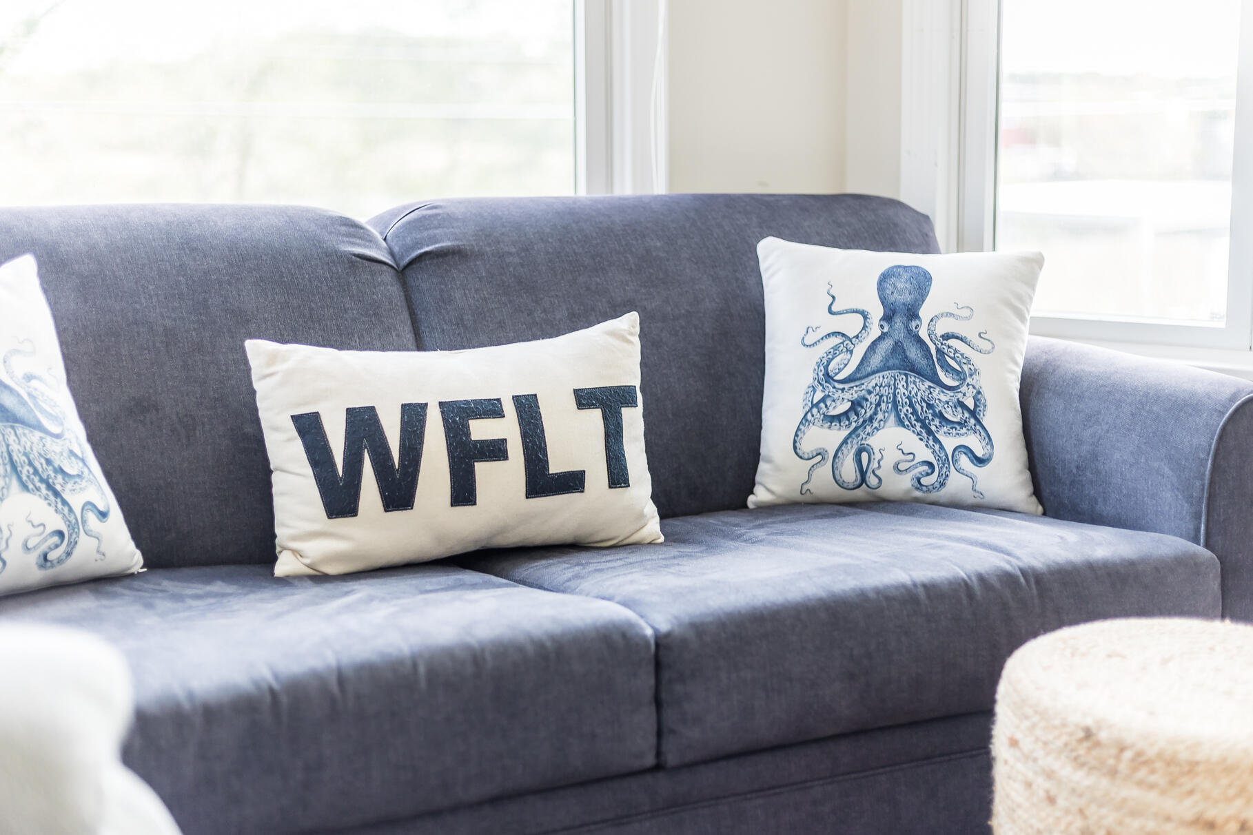 70 Commercial Street, Unit C Wellfleet, MA 02667 - Photo 14 of 32 a white couch sitting next to a window
