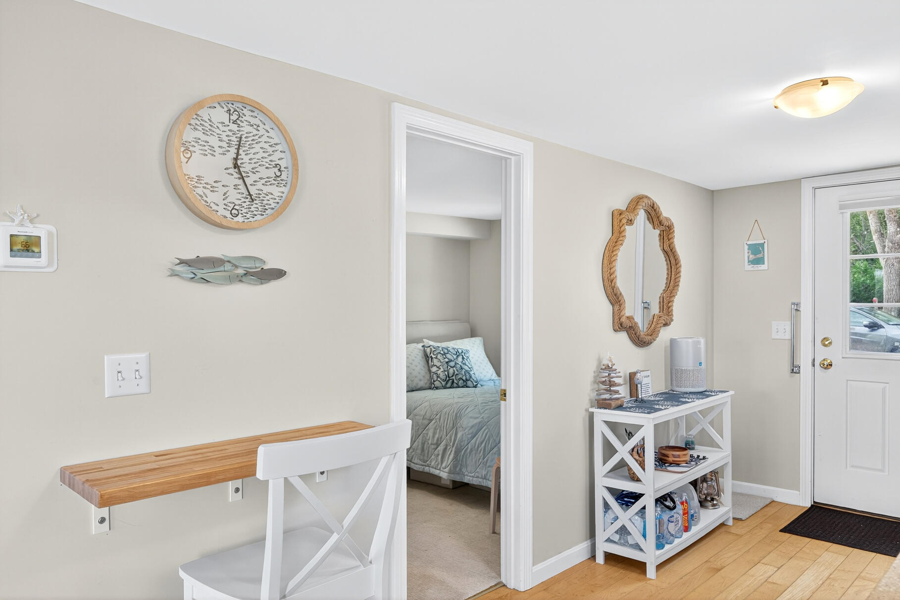70 Commercial Street, Unit C Wellfleet, MA 02667 - Photo 16 of 32 a living room with furniture and a mirror