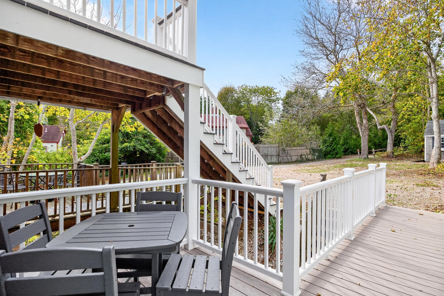 70 Commercial Street, Unit C Wellfleet, MA 02667 - Photo 29 of 32 a view of a wooden chairs on deck and floor