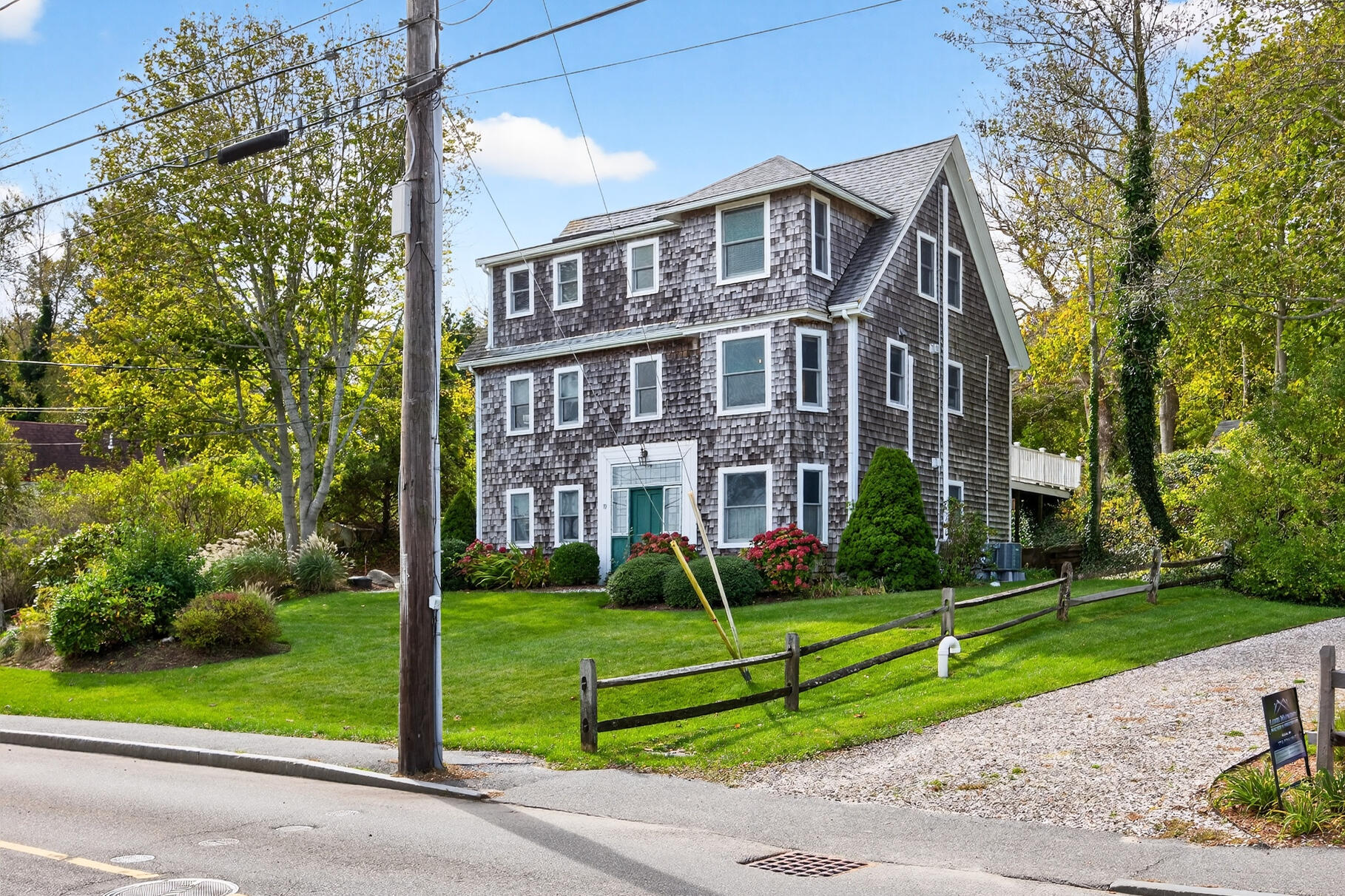 70 Commercial Street, Unit C Wellfleet, MA 02667 - Photo 30 of 32 a front view of a building with garden