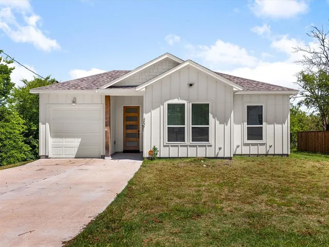 a view of house with yard