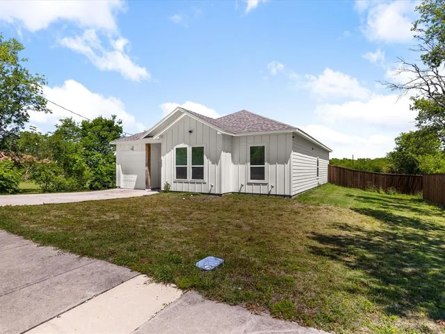 a backyard of a house with lots of green space