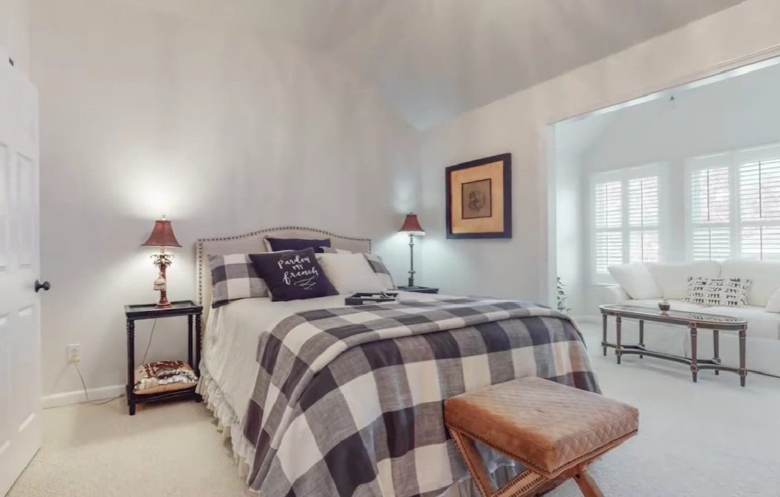 604 Watermark Way Franklin, TN 37064 - Photo 14 of 37 a bedroom with a bed and a table in it