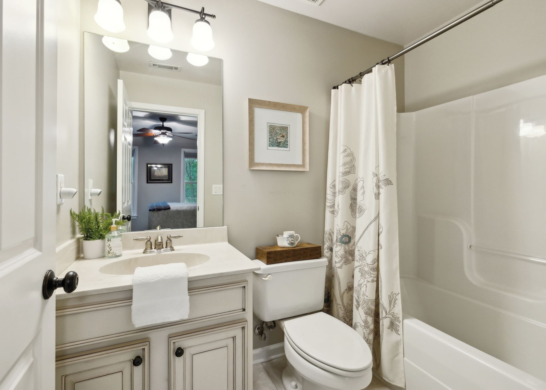 604 Watermark Way Franklin, TN 37064 - Photo 18 of 37 a bathroom with a sink a toilet a mirror a vanity and shower