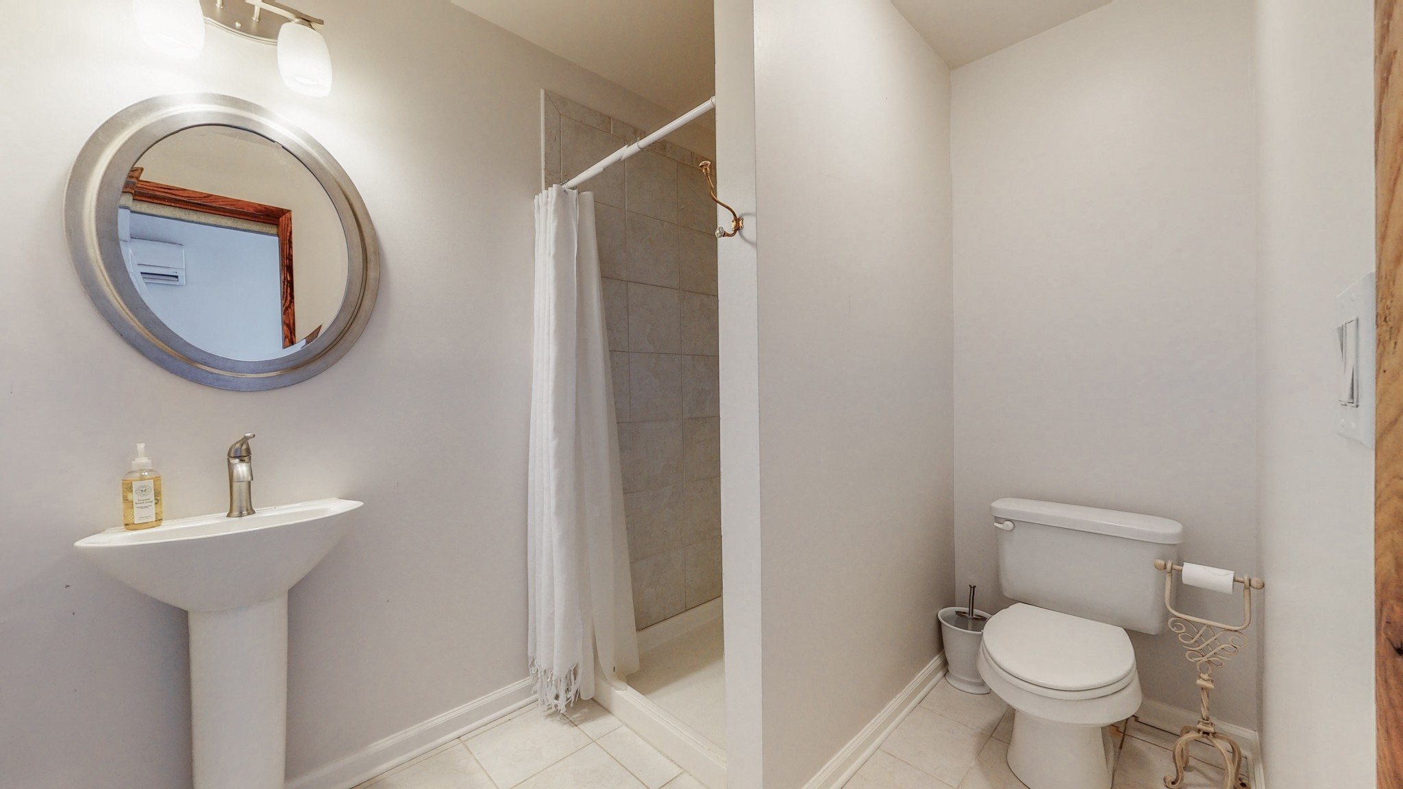 604 Watermark Way Franklin, TN 37064 - Photo 27 of 37 a bathroom with a toilet sink and mirror