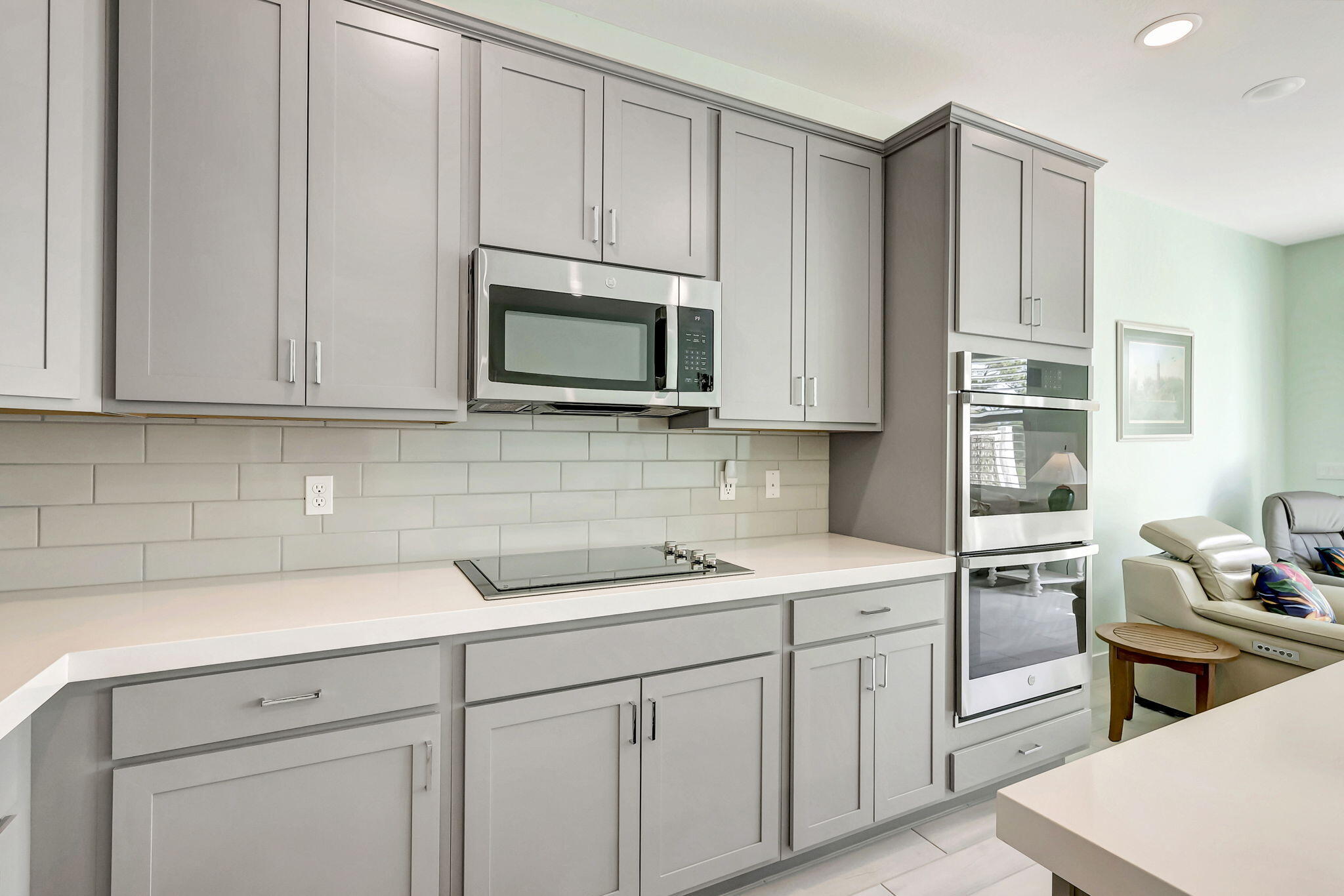1404 Gopher Terrace Stuart, FL 34994 - Photo 13 of 52 a kitchen with cabinets appliances a sink and a counter space