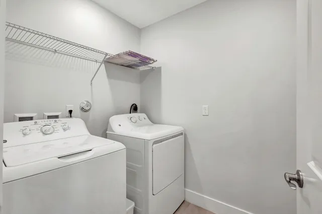 a view of cabinets with racks on the wall