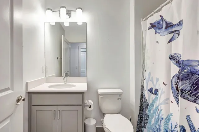 a living room with furniture and a lamp