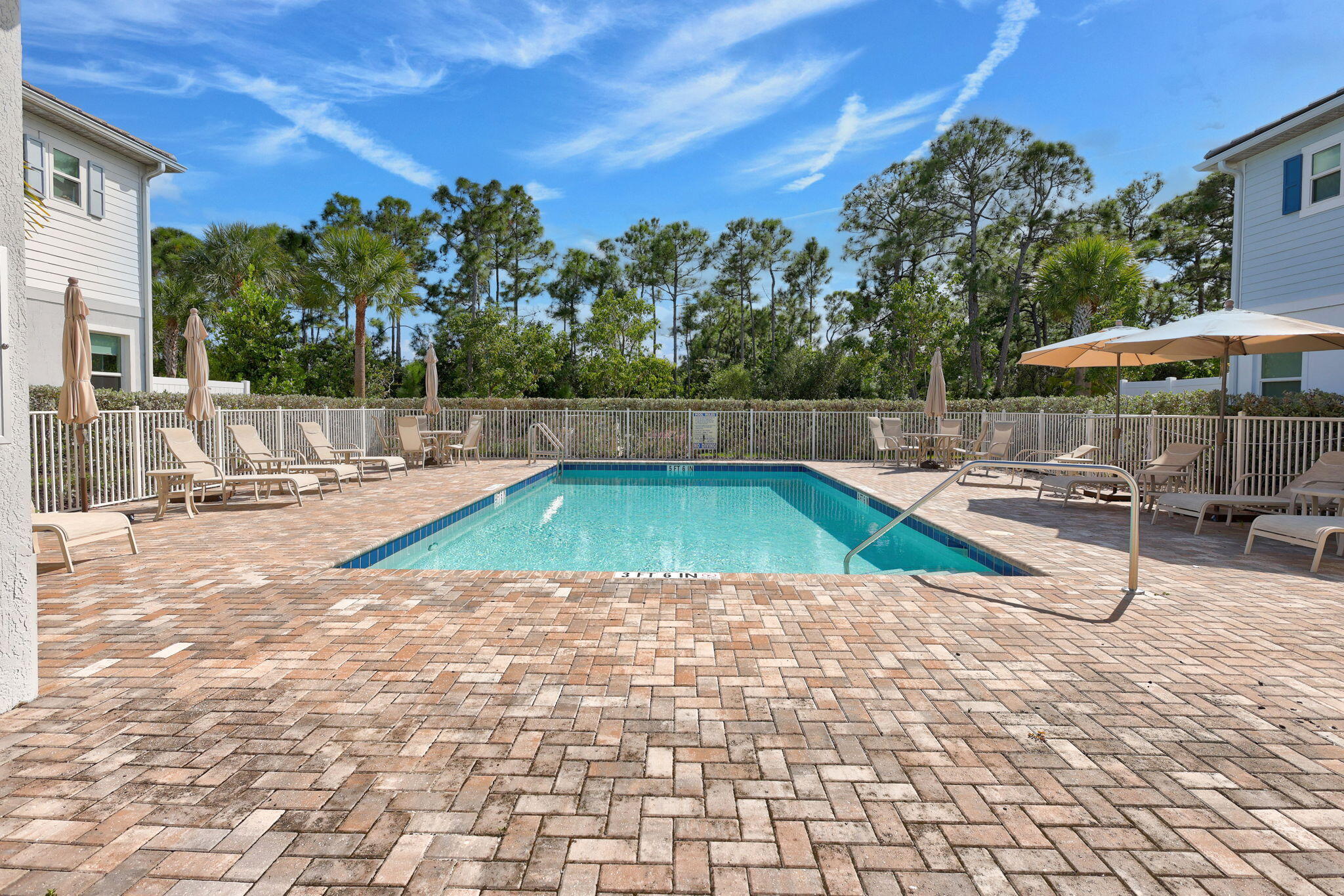 1404 Gopher Terrace Stuart, FL 34994 - Photo 38 of 52 a view of a swimming pool with a patio