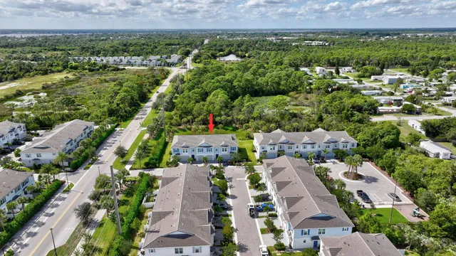 an aerial view of residential houses with outdoor space