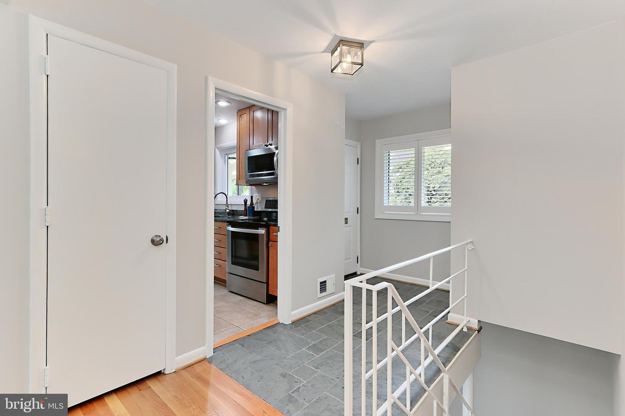 6534 Kerns Road Falls Church, VA 22044 - Photo 8 of 42 Foyer with open access to lower level