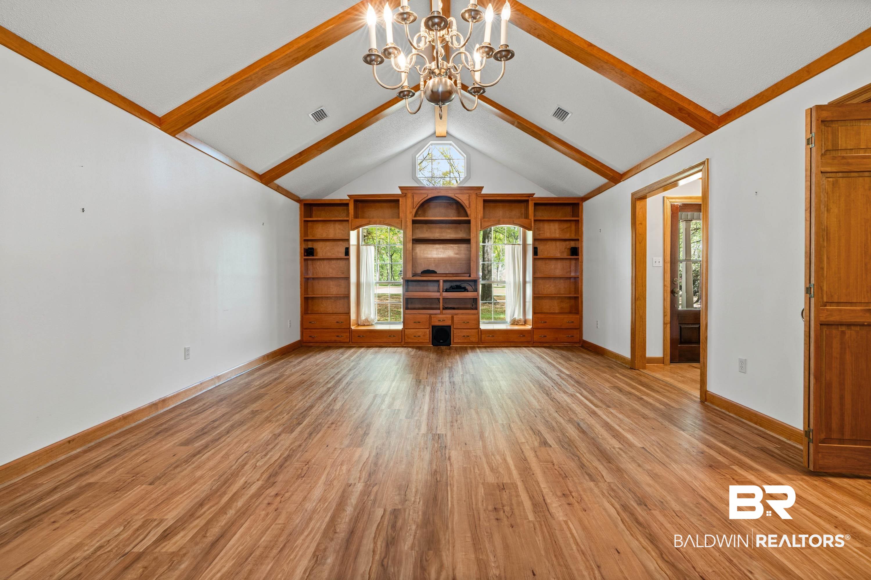 10140 Lakeview Road Bay Minette, AL 36507 - Photo 5 of 35 Unfurnished living room featuring hanging lights and light wood finished floors