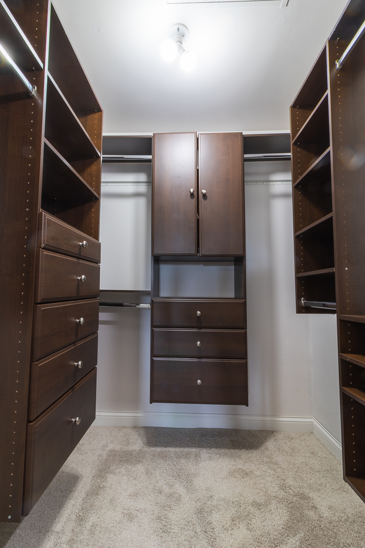 6317 Clarendon Hills Road, Unit 2 Willowbrook, IL 60527 - Photo 13 of 21 a room with furniture and a walk in closet