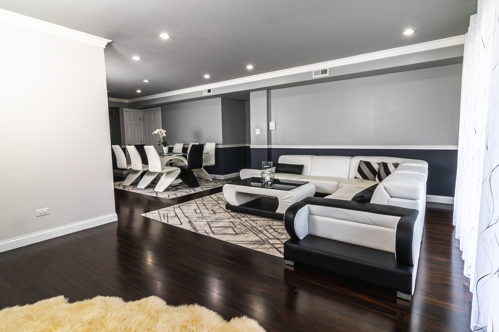 6317 Clarendon Hills Road, Unit 2 Willowbrook, IL 60527 - Photo 3 of 21 a living room with furniture and a wooden floor