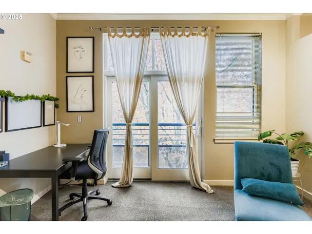 a workspace with furniture and a window