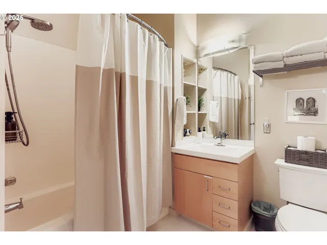 a view of a hallway with washer and dryer