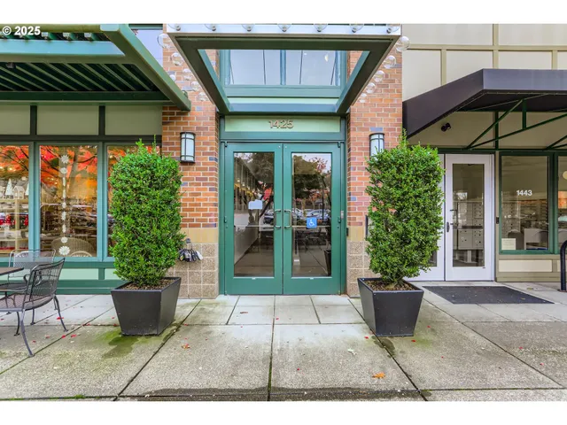 a view of a patio with table and chairs potted plants