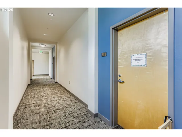 a view of a patio with table and chairs and potted plants