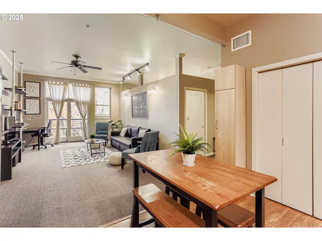a view of a livingroom with furniture and window
