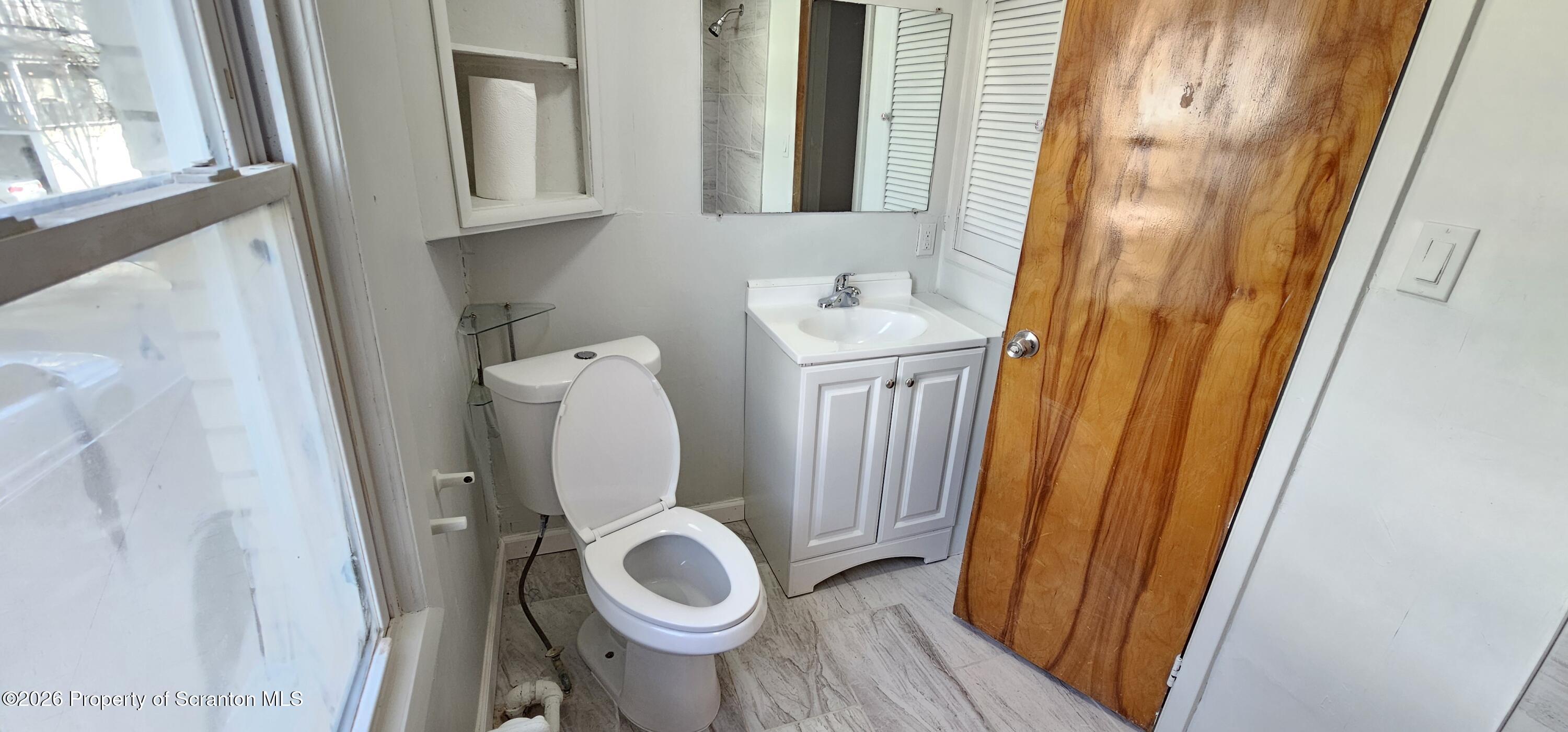 1919 Price Street Scranton, PA 18504 - Photo 11 of 20 a bathroom with a toilet and a sink