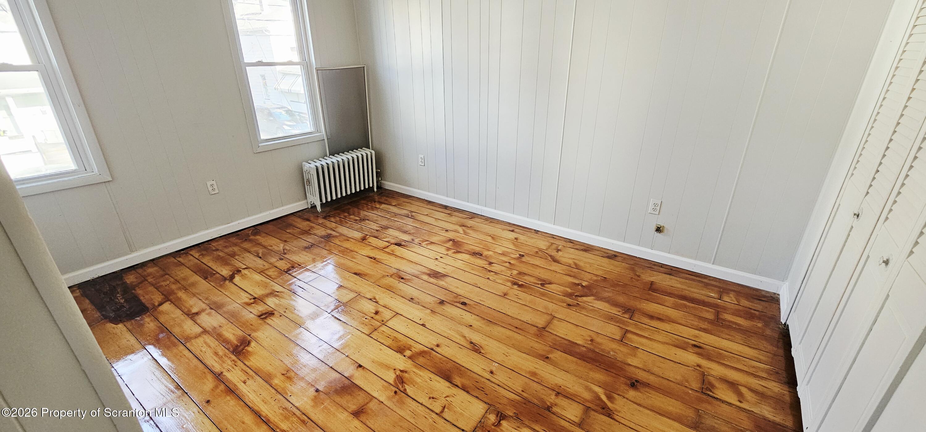 1919 Price Street Scranton, PA 18504 - Photo 13 of 20 a view of room with window and wooden floor