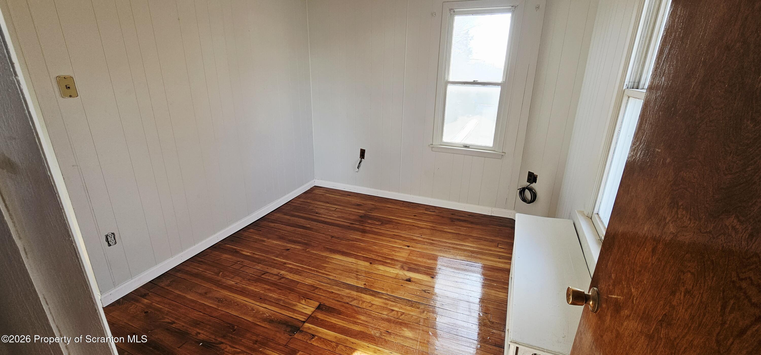1919 Price Street Scranton, PA 18504 - Photo 15 of 20 a view of a room with wooden floor and window