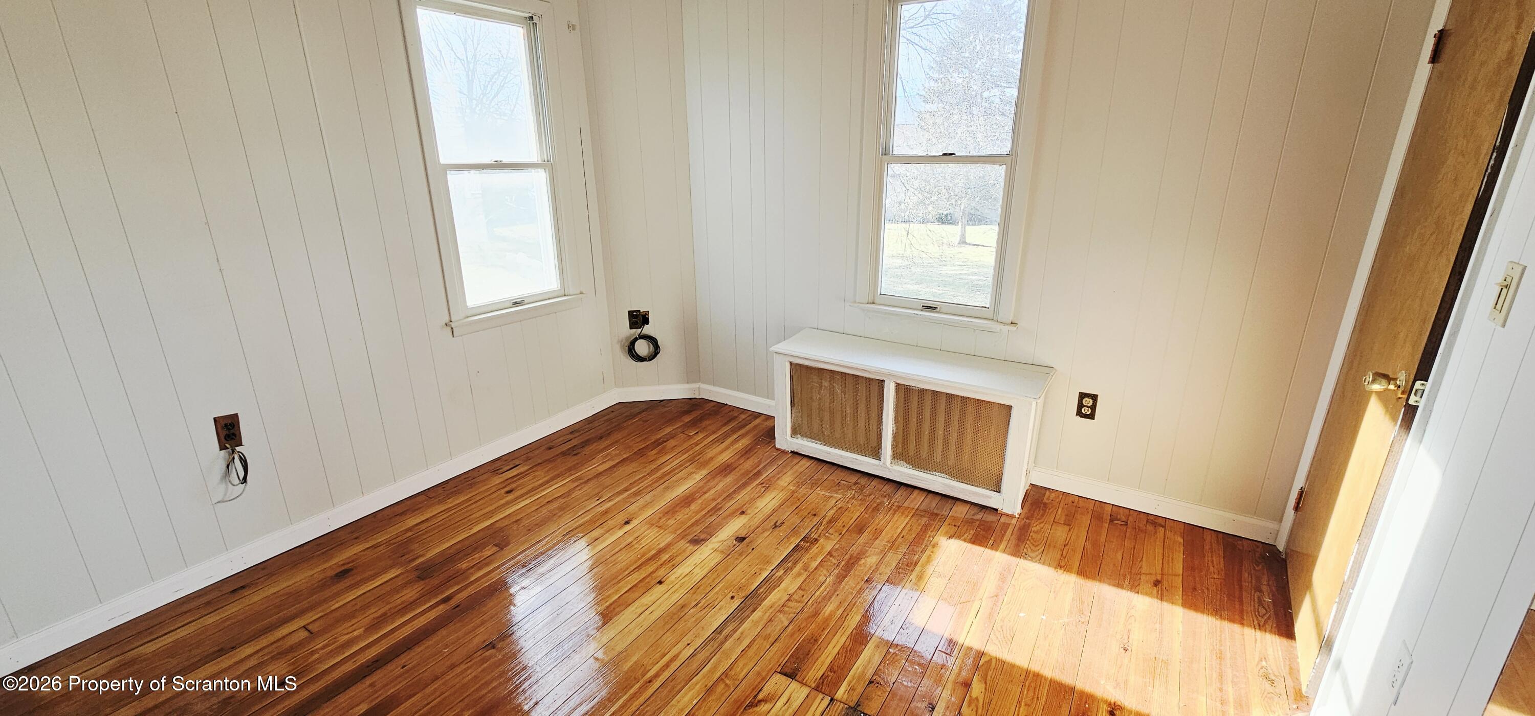 1919 Price Street Scranton, PA 18504 - Photo 16 of 20 a view of empty room with wooden floor and fan