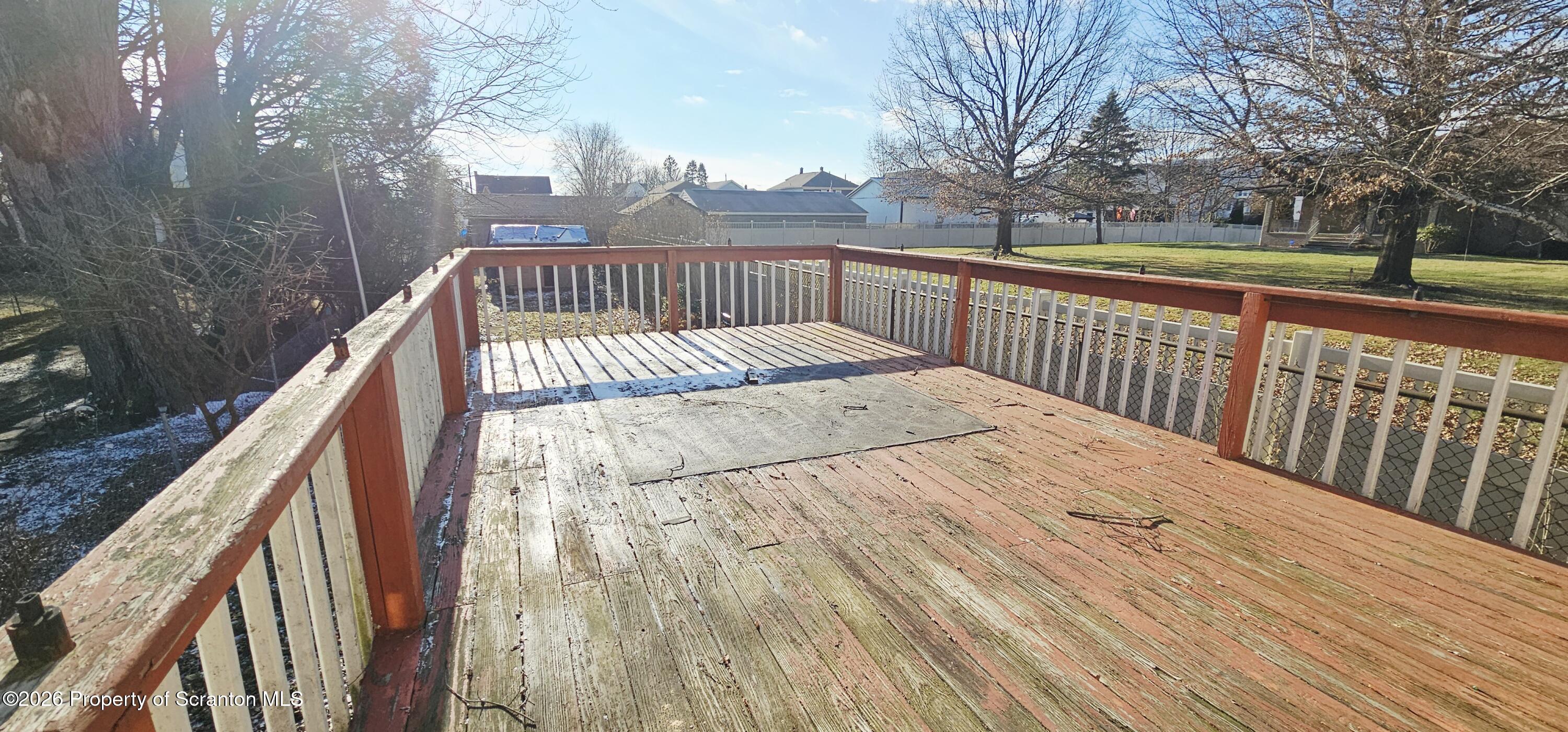 1919 Price Street Scranton, PA 18504 - Photo 19 of 20 a view of balcony with wooden floor and fence