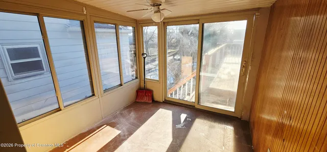 a view of an entryway with a floor to ceiling window
