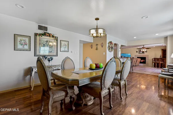 a view of a dining room with furniture and wooden floor