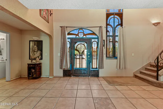 a view of entryway and hall with a mirror