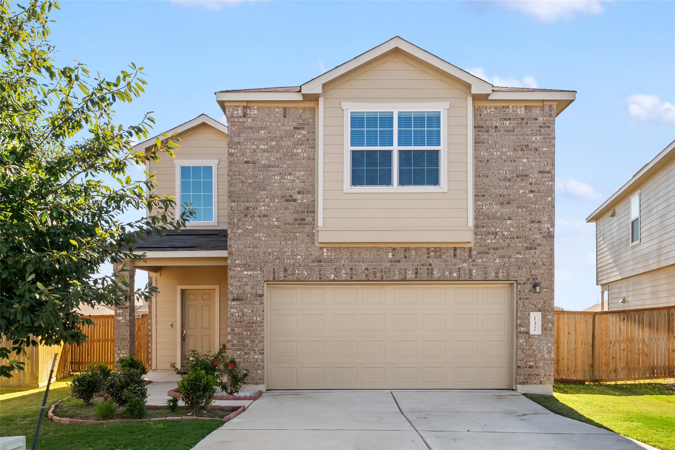 132 Joe Kidd Lane Jarrell, TX 76537 - Photo 2 of 39 a front view of a house with garden