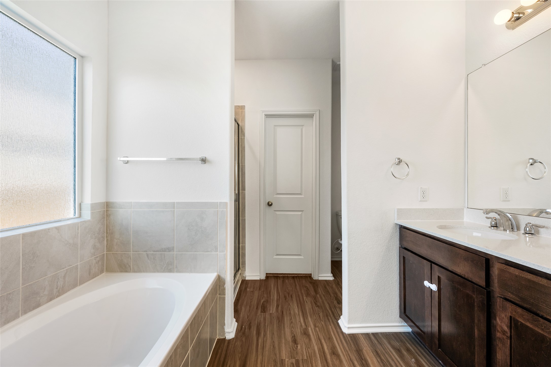 132 Joe Kidd Lane Jarrell, TX 76537 - Photo 21 of 39 a bathroom with a tub sink and mirror