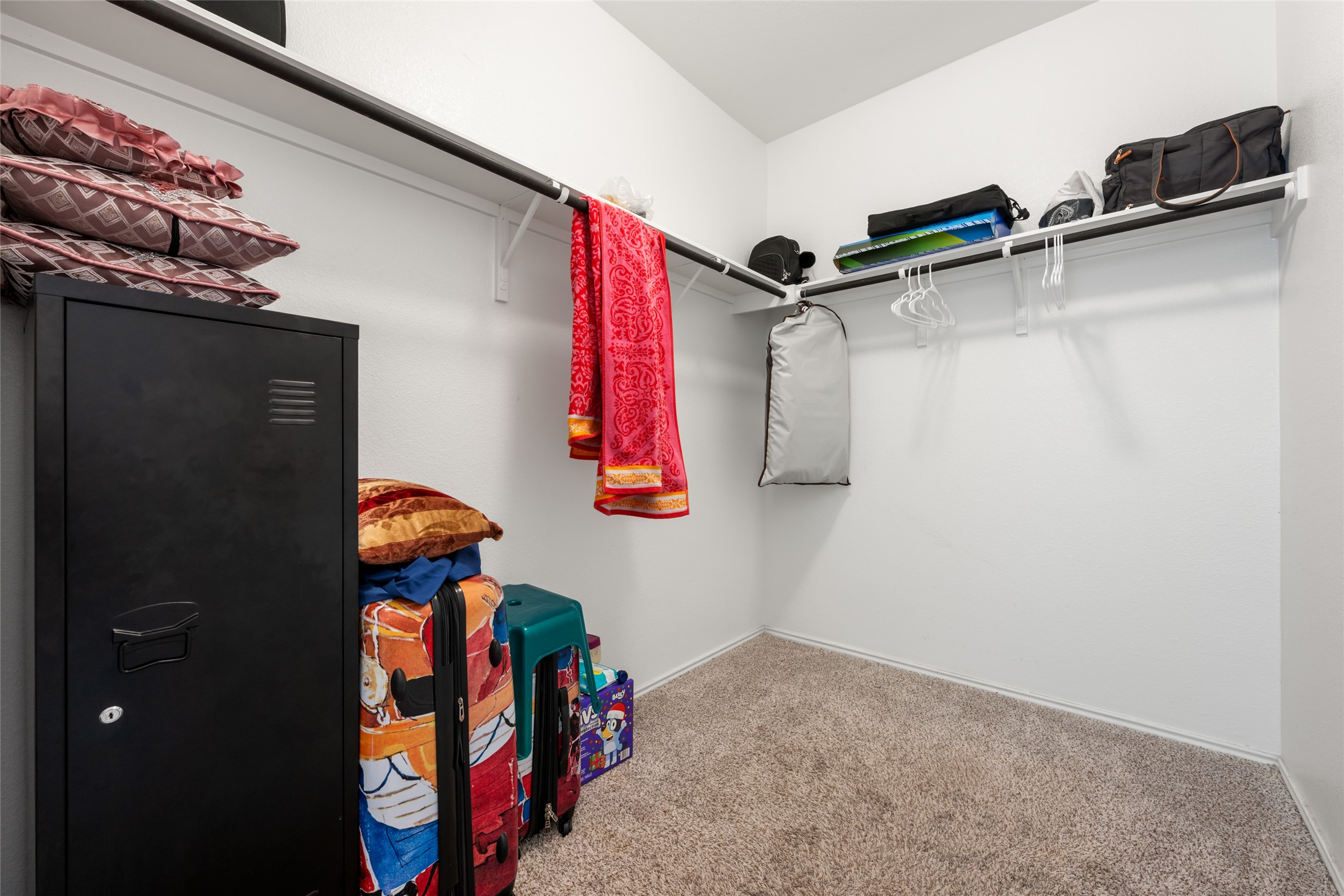 132 Joe Kidd Lane Jarrell, TX 76537 - Photo 22 of 39 a view of walk in closet with clothes and shoes